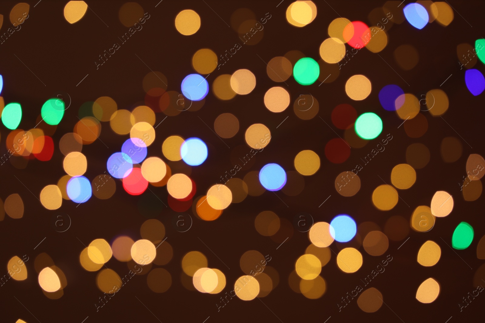 Photo of Blurred view of colorful lights on dark background, bokeh effect