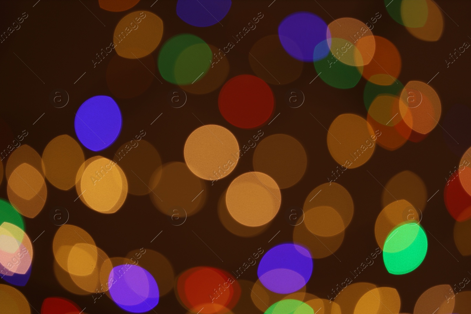 Photo of Blurred view of colorful lights on dark background, bokeh effect