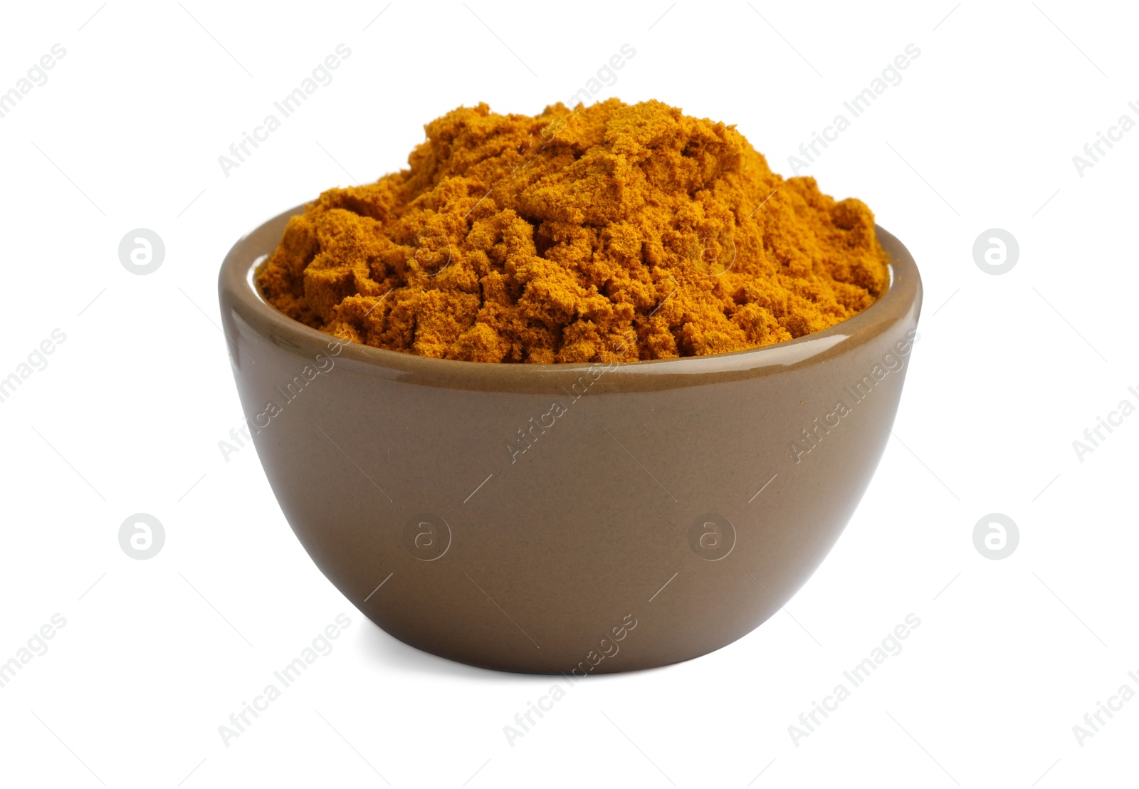 Photo of Turmeric powder in bowl isolated on white