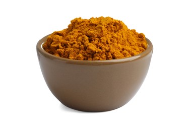 Photo of Turmeric powder in bowl isolated on white