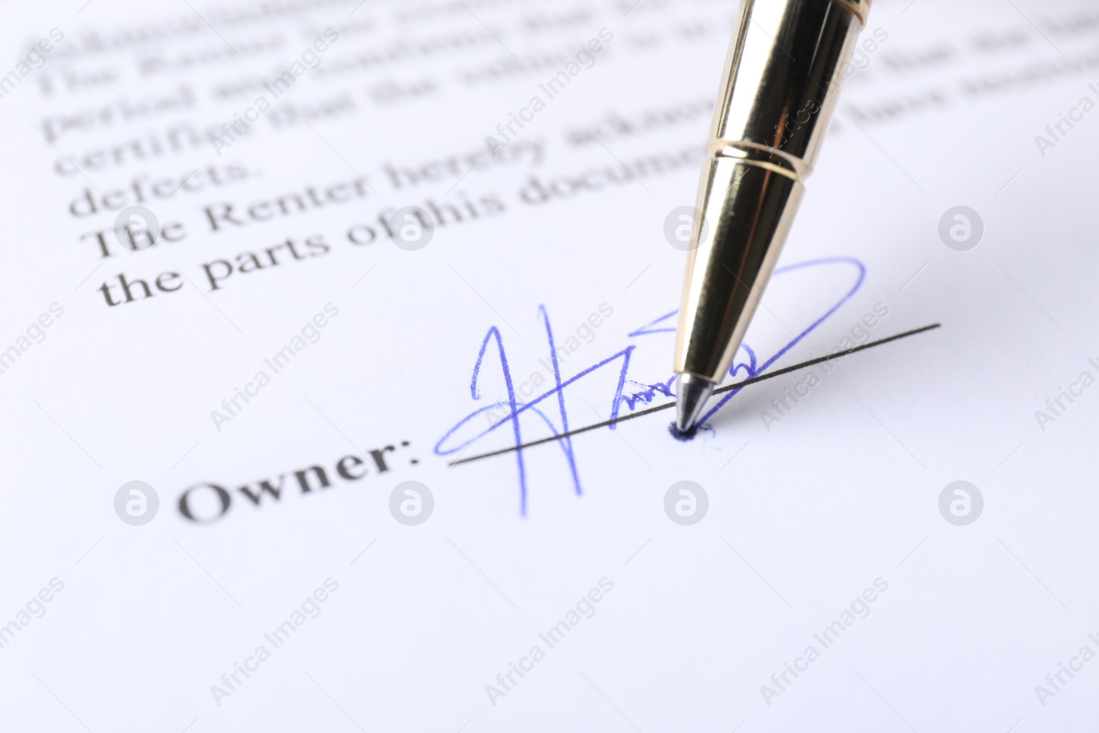 Photo of Pen leaving signature on contract, closeup view