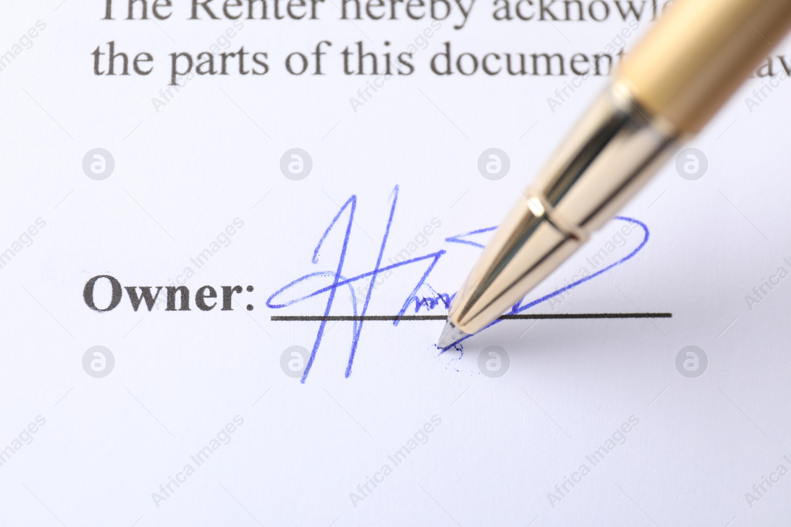 Photo of Pen leaving signature on contract, closeup view