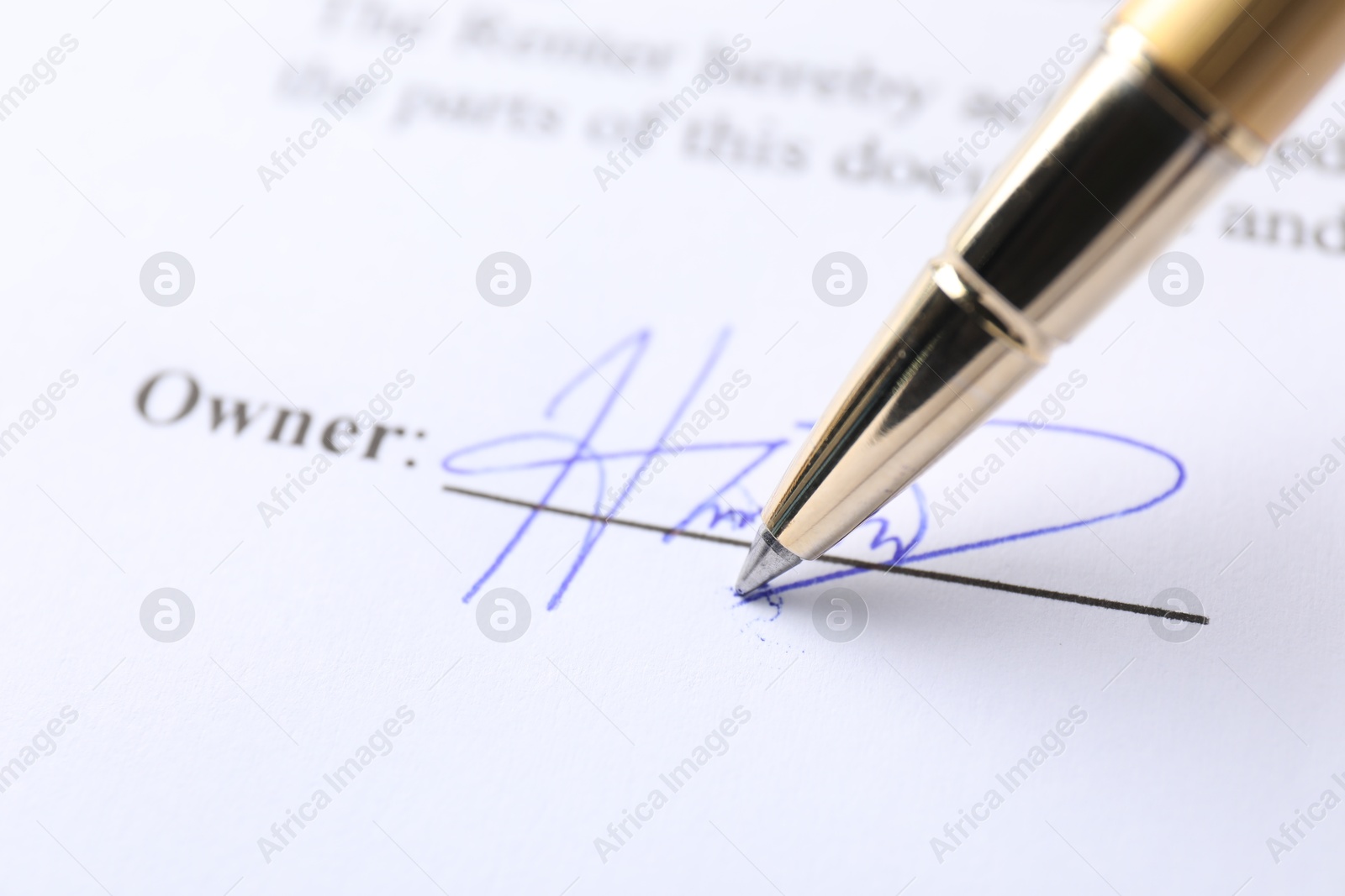 Photo of Pen leaving signature on contract, closeup view