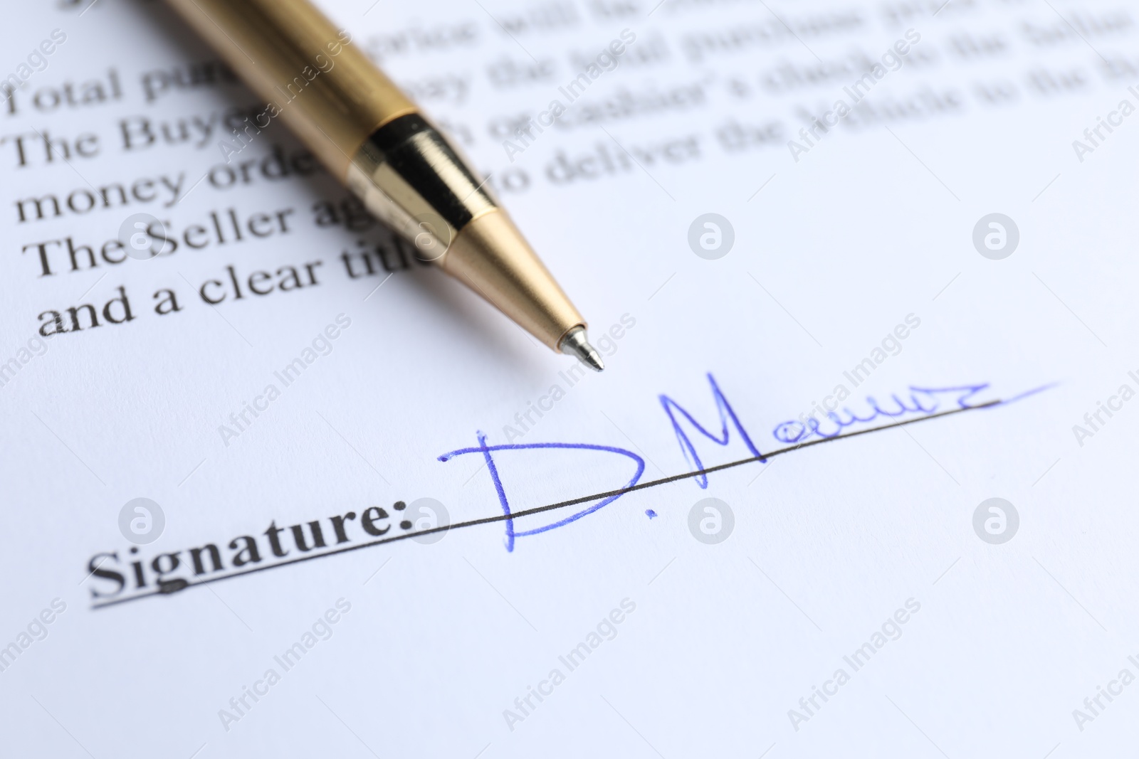 Photo of Ballpoint pen and signature on contract, closeup