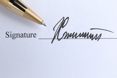 Ballpoint pen and signature on contract, top view