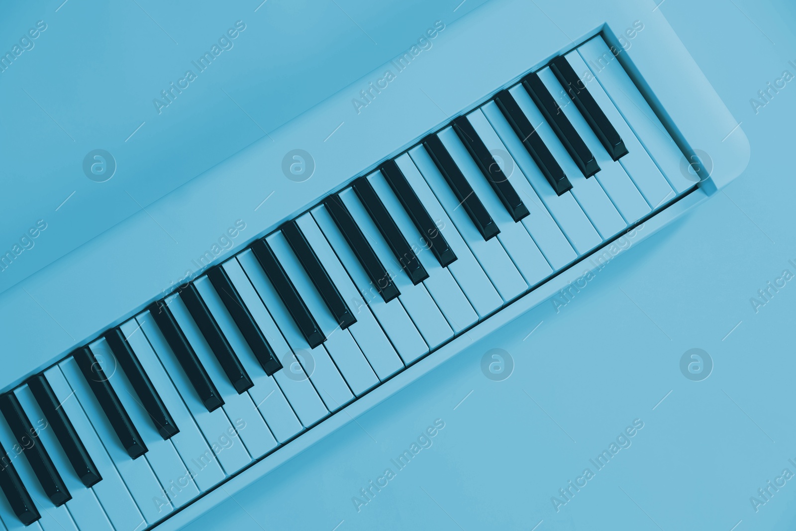 Image of Synthesizer, top view. Toned in light blue color. Electronic musical instrument