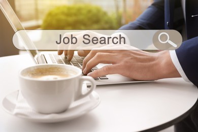 Image of Job Search. Man using laptop at table, closeup. Search bar with words