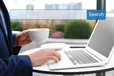 Job Search. Man with laptop and cup of coffee at table, closeup. Search bar with word