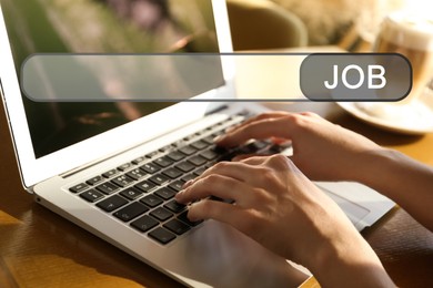 Image of Job Search. Woman using laptop at table, closeup. Search bar with word