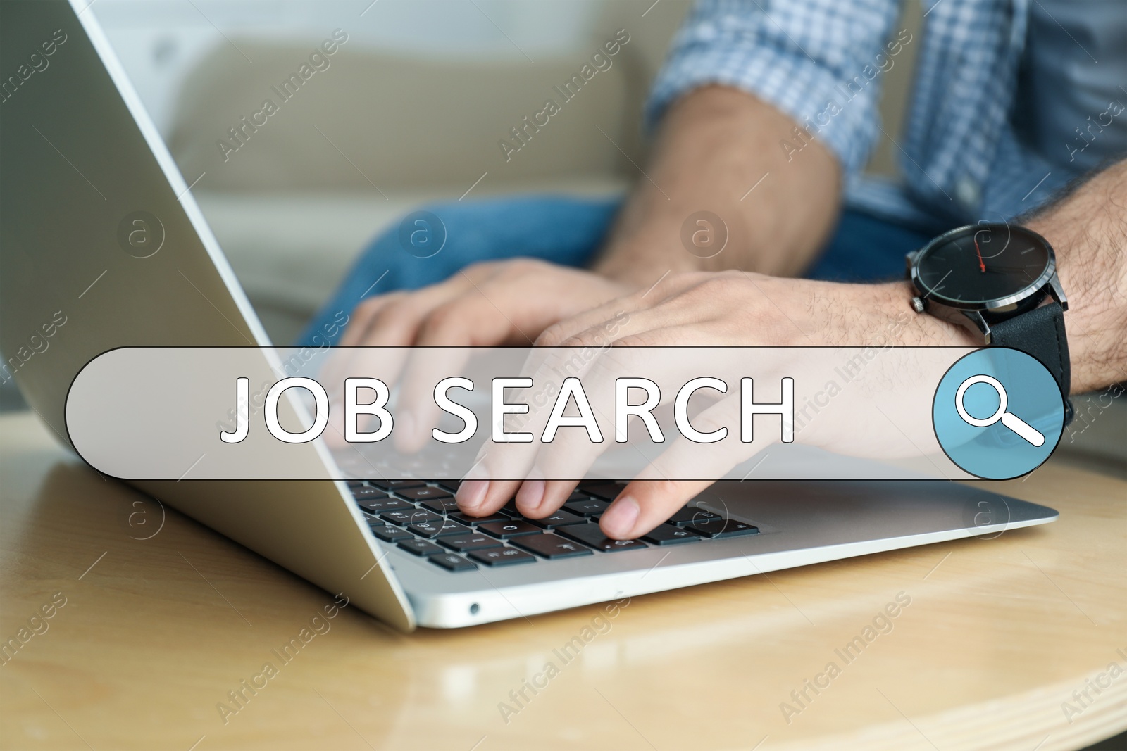 Image of Job Search. Man using laptop at table, closeup. Search bar with words