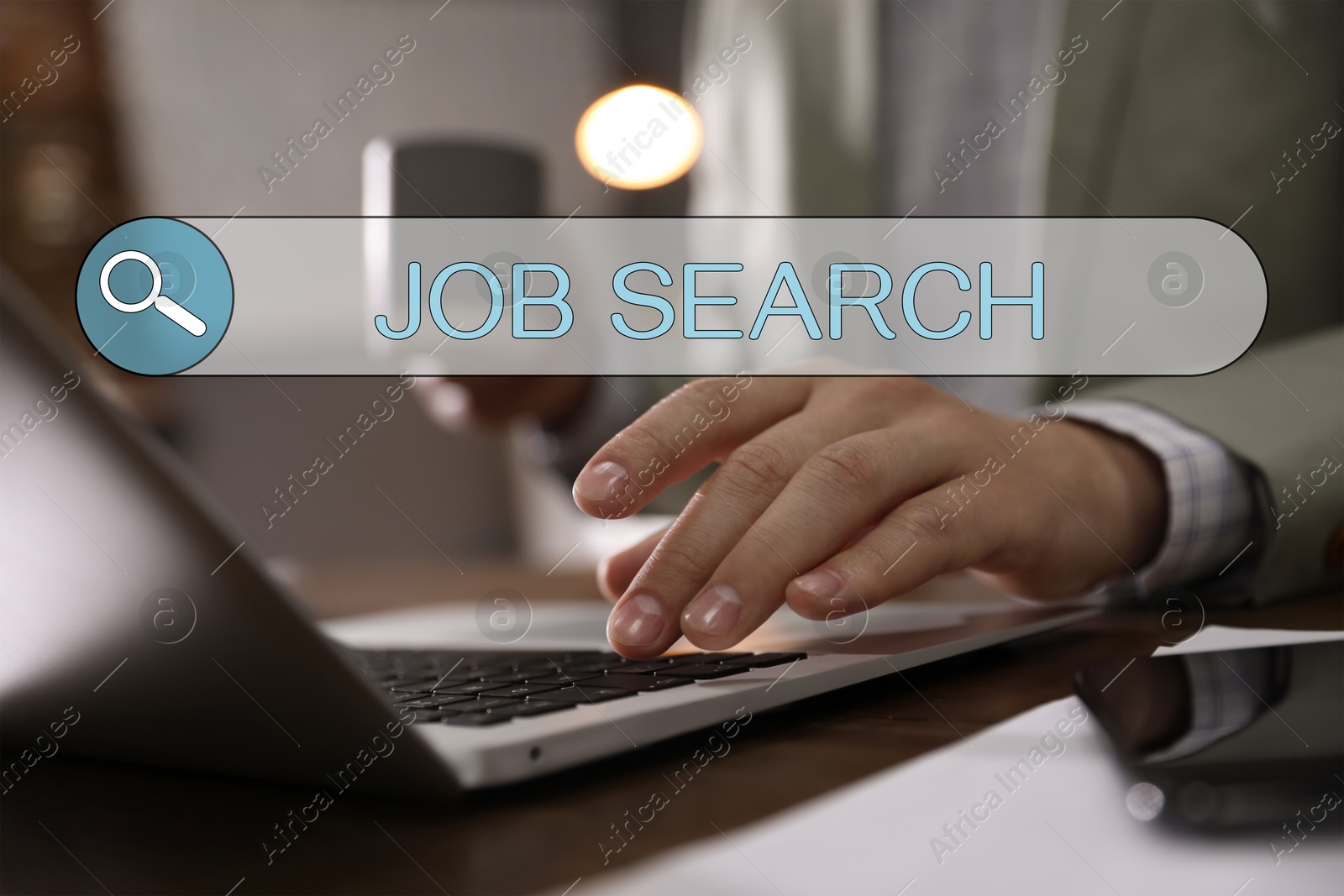 Image of Job Search. Man using laptop at table, closeup. Search bar with words