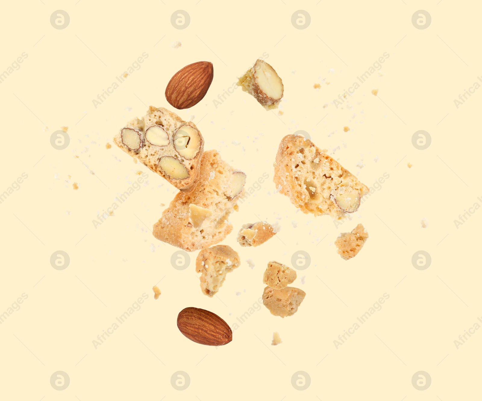 Image of Tasty cookies with almond nuts in air on beige background. Traditional Italian Cantuccini