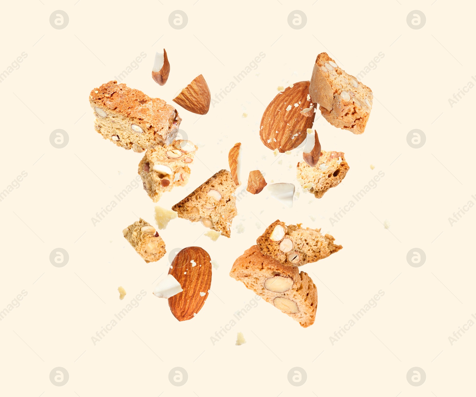 Image of Tasty cookies with almond nuts in air on beige background. Traditional Italian Cantuccini