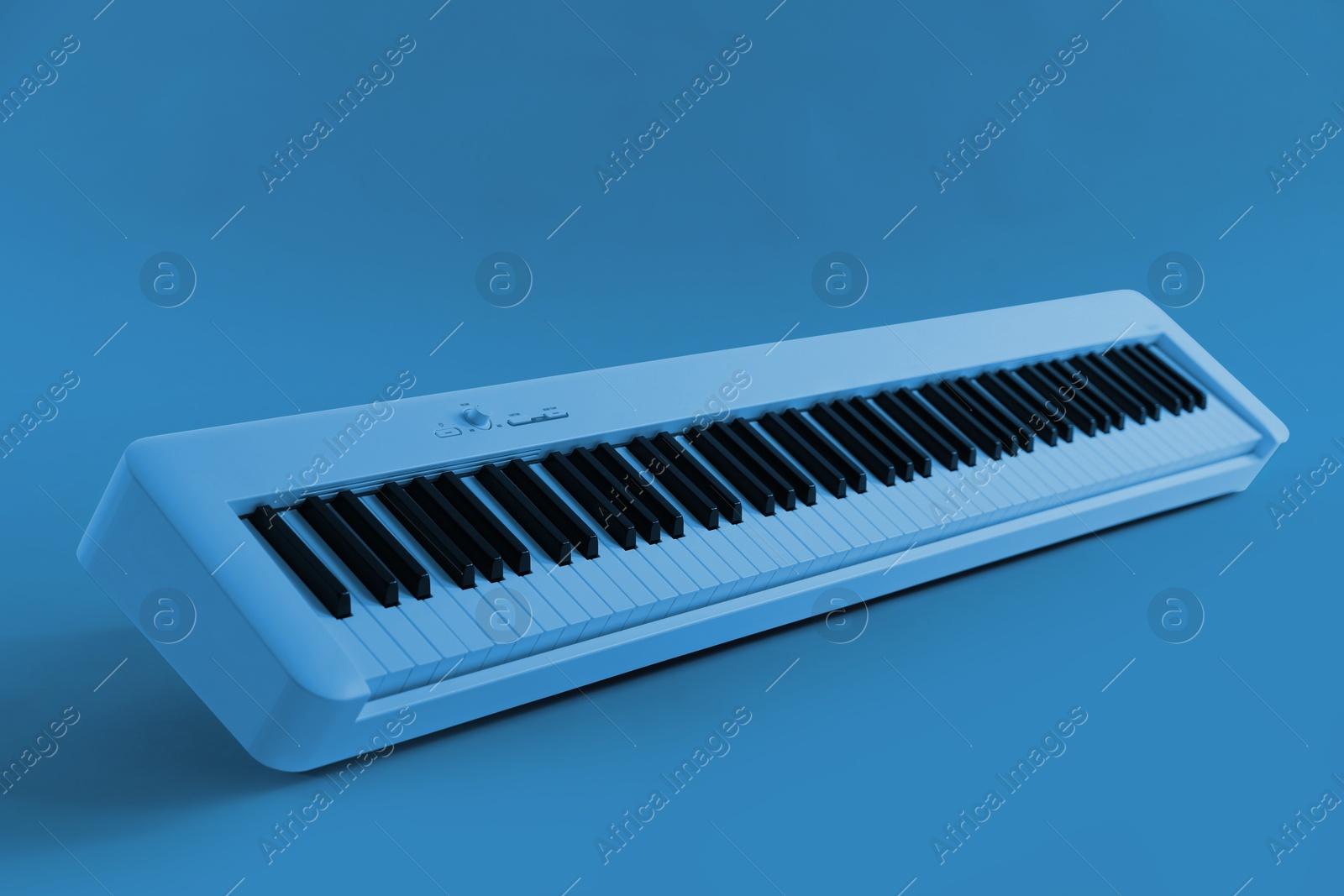 Image of Synthesizer, toned in light blue color. Electronic musical instrument