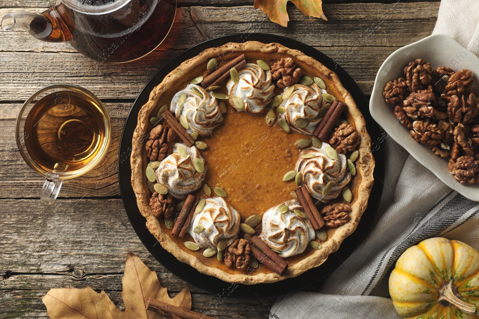 Photo of Flat lay composition with homemade pumpkin pie on wooden table