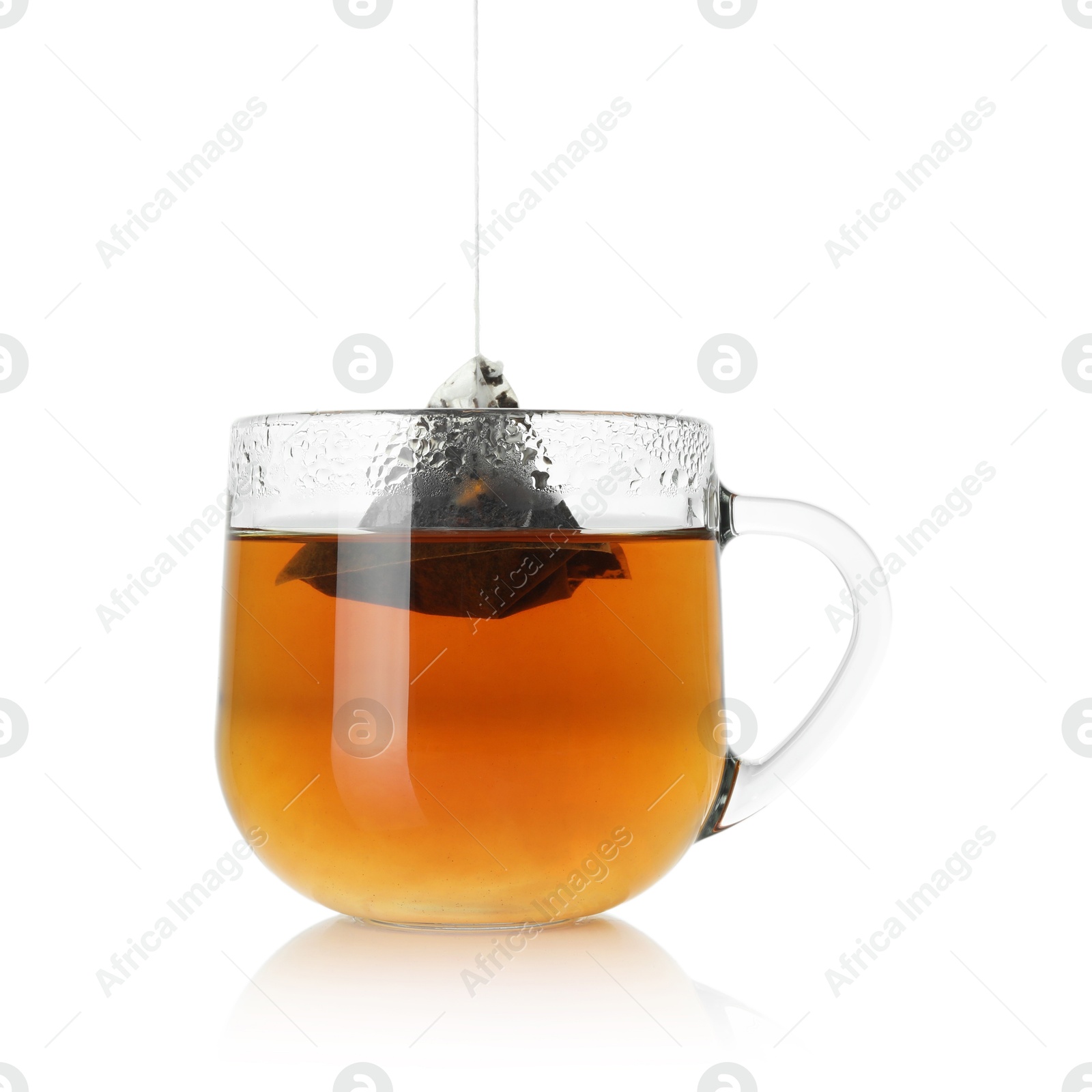 Photo of Cup with tea bag isolated on white