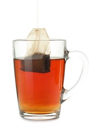 Photo of Cup with teabag isolated on white. Brewing aromatic tea