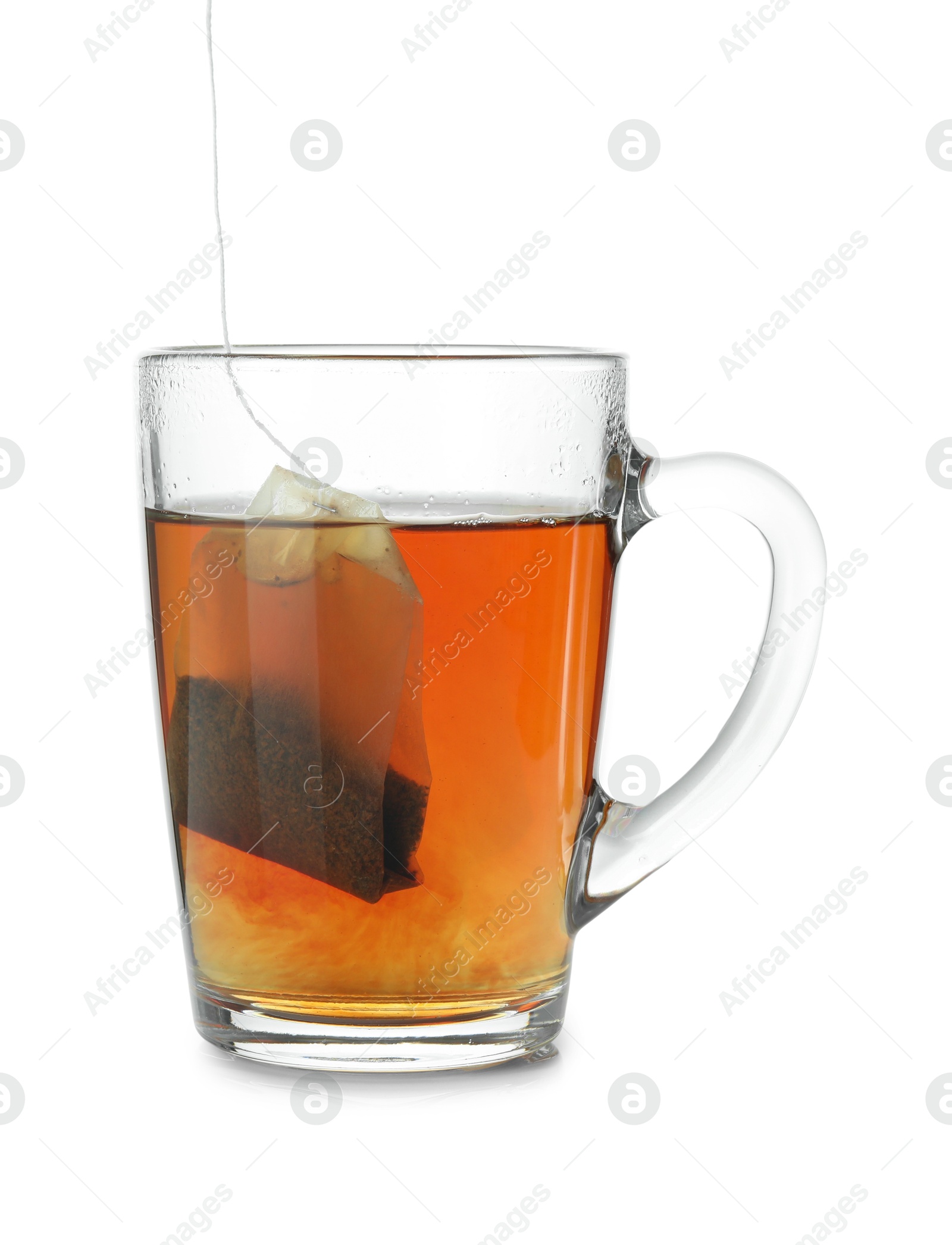 Photo of Cup with teabag isolated on white. Brewing aromatic tea