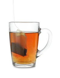 Photo of Cup with teabag isolated on white. Brewing aromatic tea