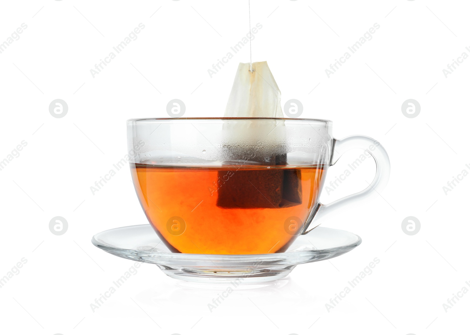 Photo of Cup with teabag isolated on white. Brewing aromatic tea