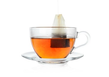 Photo of Cup with teabag isolated on white. Brewing aromatic tea