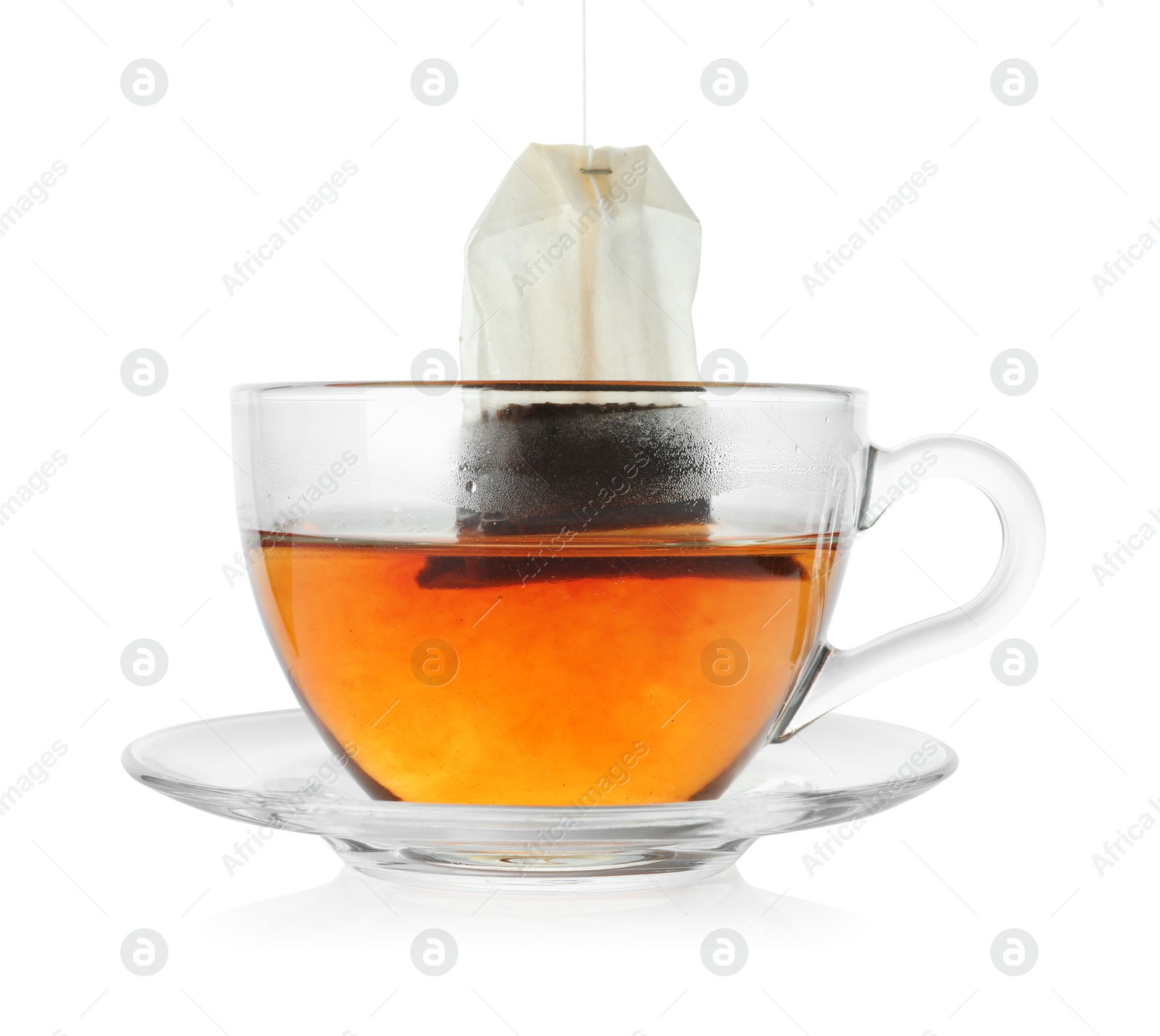 Photo of Cup with teabag isolated on white. Brewing aromatic tea