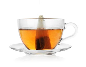 Photo of Cup with teabag isolated on white. Brewing aromatic tea