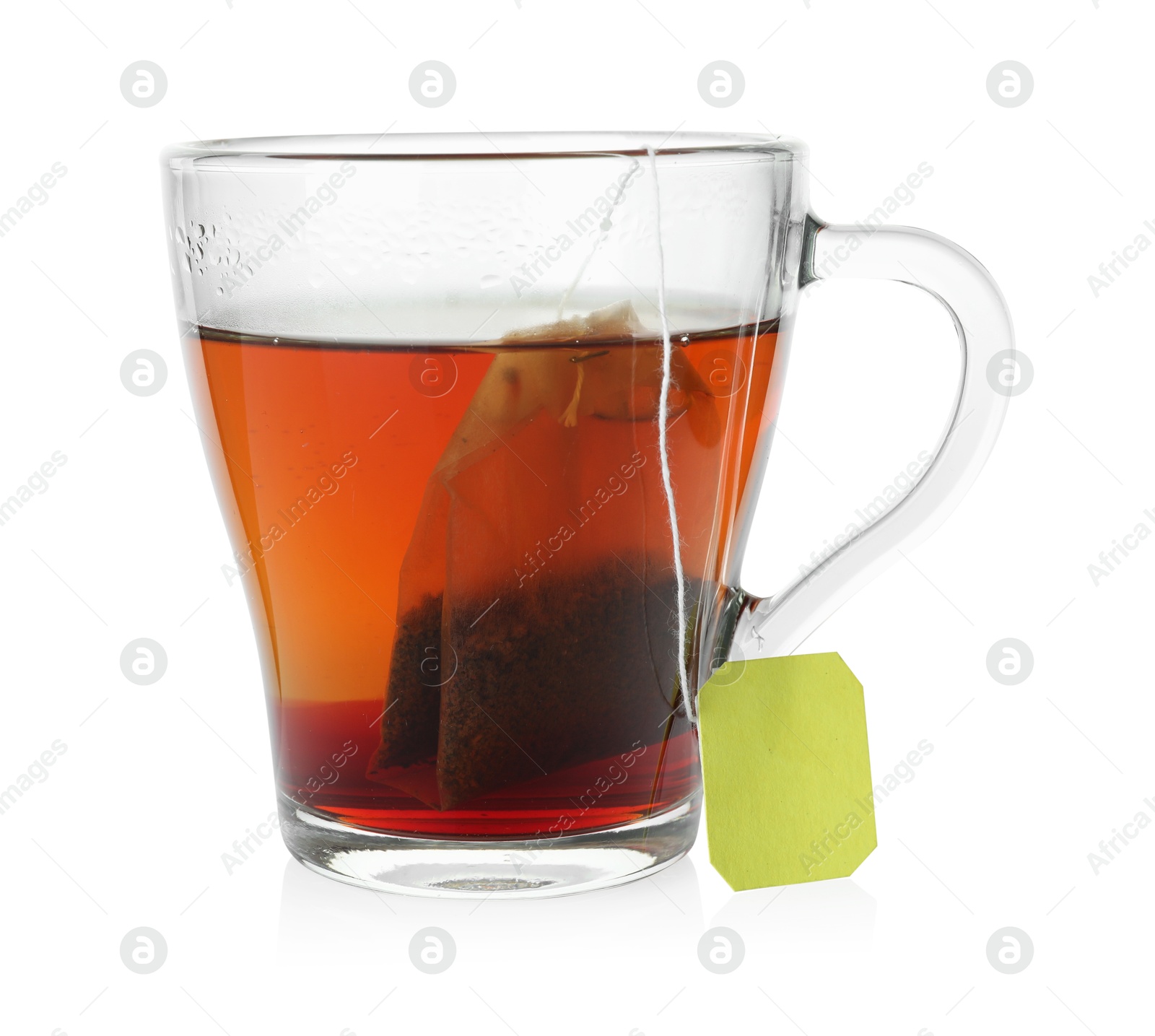 Photo of Cup with teabag isolated on white. Brewing aromatic tea