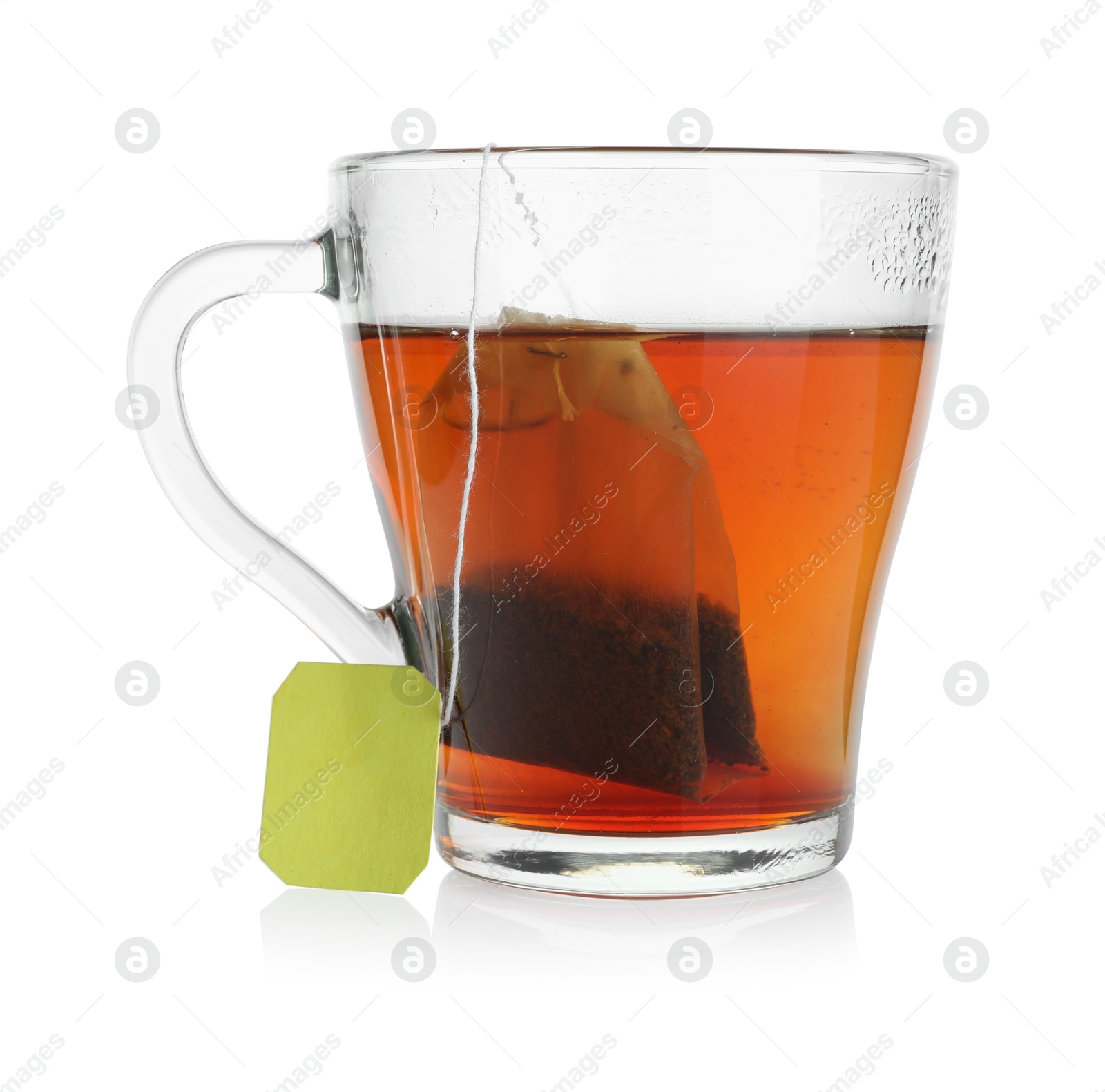 Photo of Cup with teabag isolated on white. Brewing aromatic tea