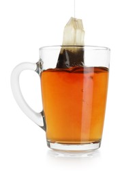 Photo of Brewing aromatic tea. Cup with teabag isolated on white