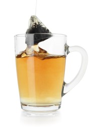 Photo of Brewing aromatic tea. Cup with teabag isolated on white