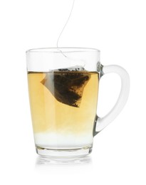 Photo of Brewing aromatic tea. Cup with teabag isolated on white