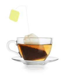 Photo of Brewing aromatic tea. Cup with teabag isolated on white