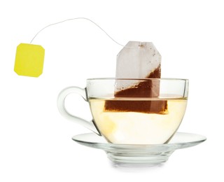 Photo of Brewing aromatic tea. Cup with teabag isolated on white