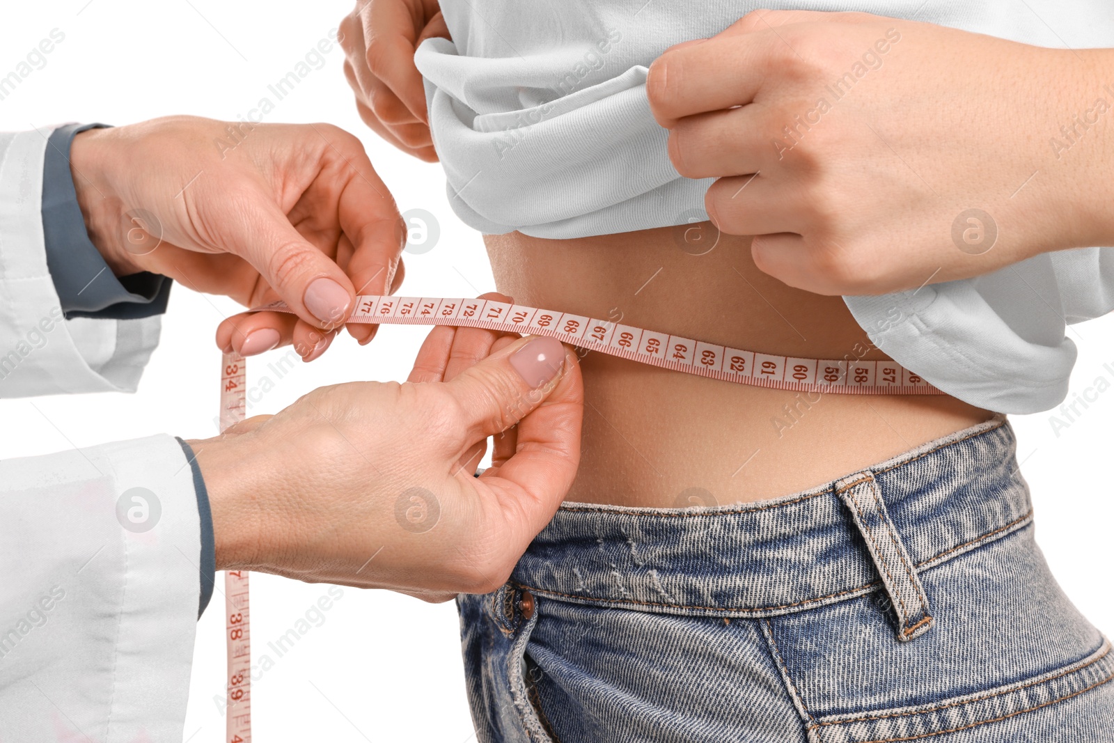 Photo of Weight loss. Nutritionist measuring patient's waist with tape on white background, closeup