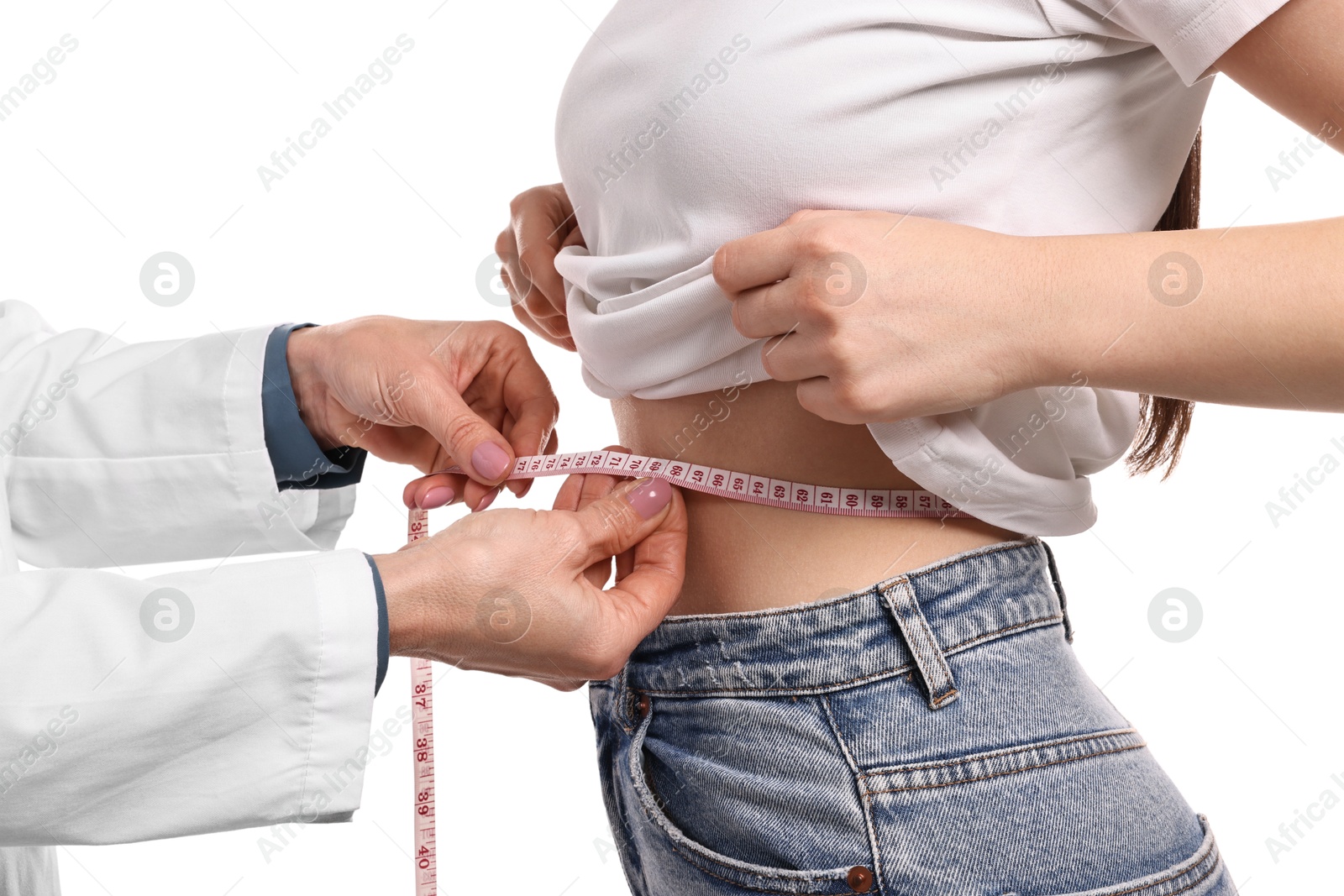 Photo of Weight loss. Nutritionist measuring patient's waist with tape on white background, closeup