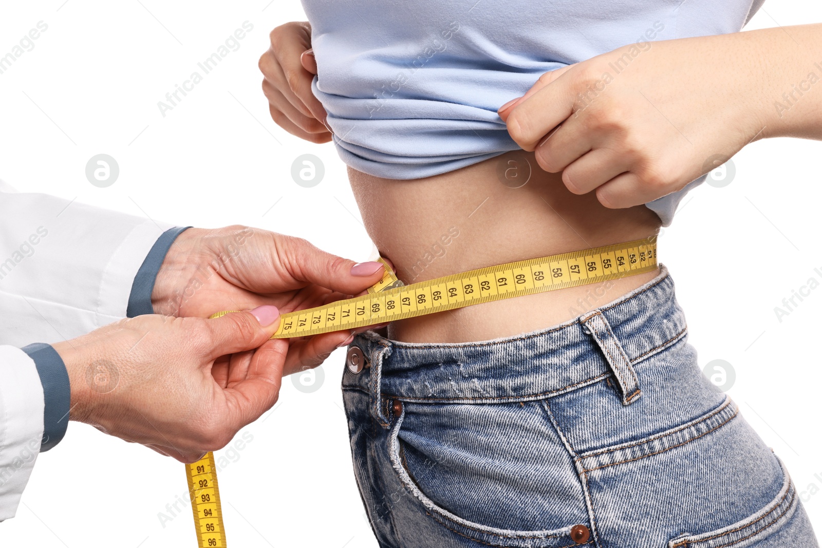 Photo of Weight loss. Nutritionist measuring patient's waist with tape on white background, closeup