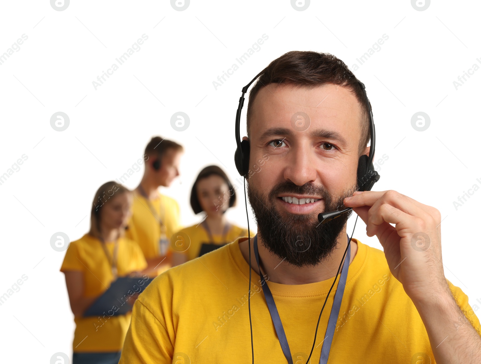 Photo of Technical support call center. Smiling operator on white background, selective focus