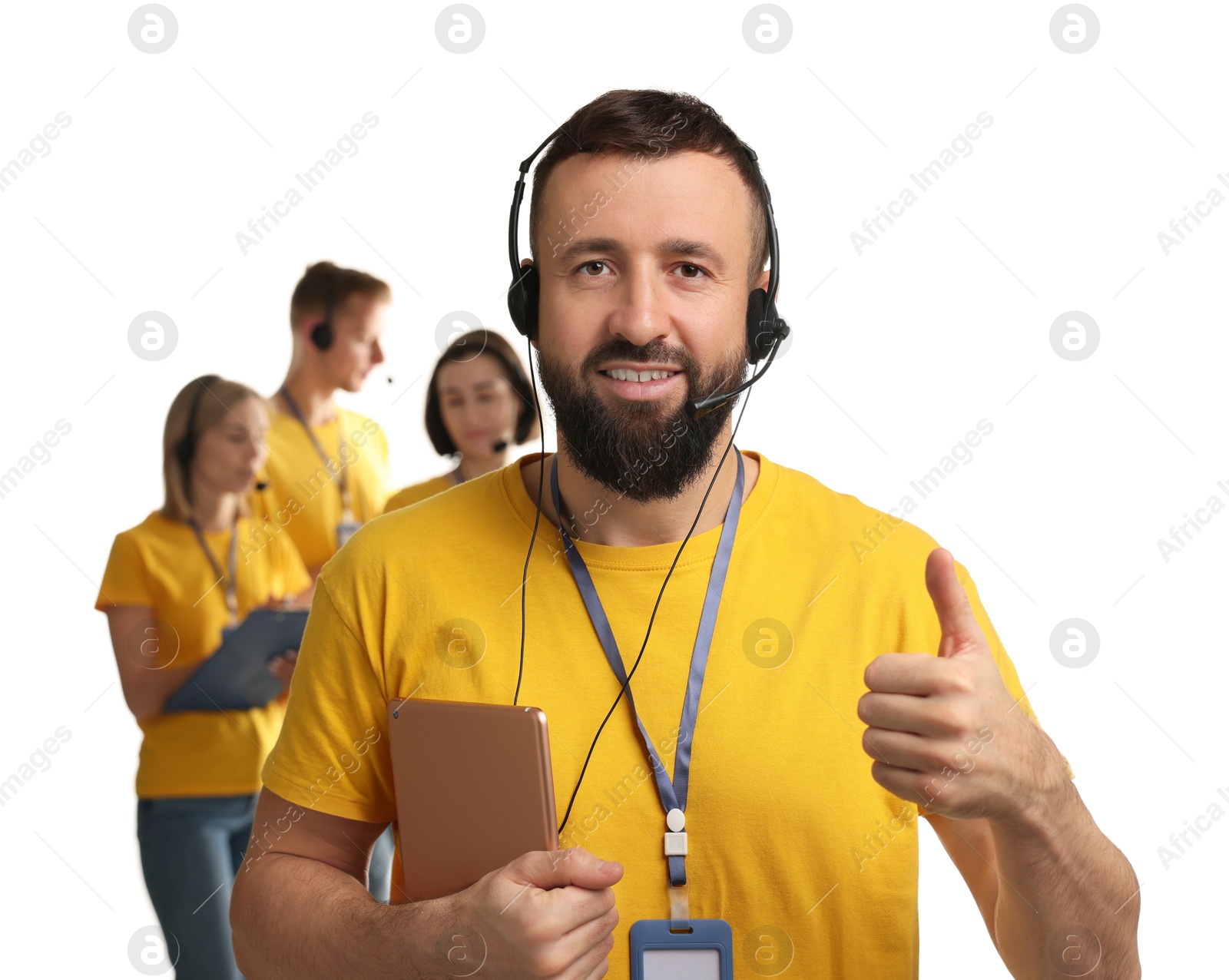 Photo of Technical support call center. Team of friendly operators on white background