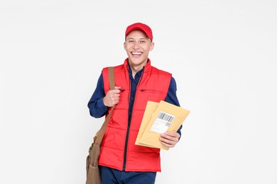 Happy postman with bag and envelopes on white background