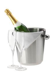 Bottle of champagne in ice bucket and empty glasses isolated on white