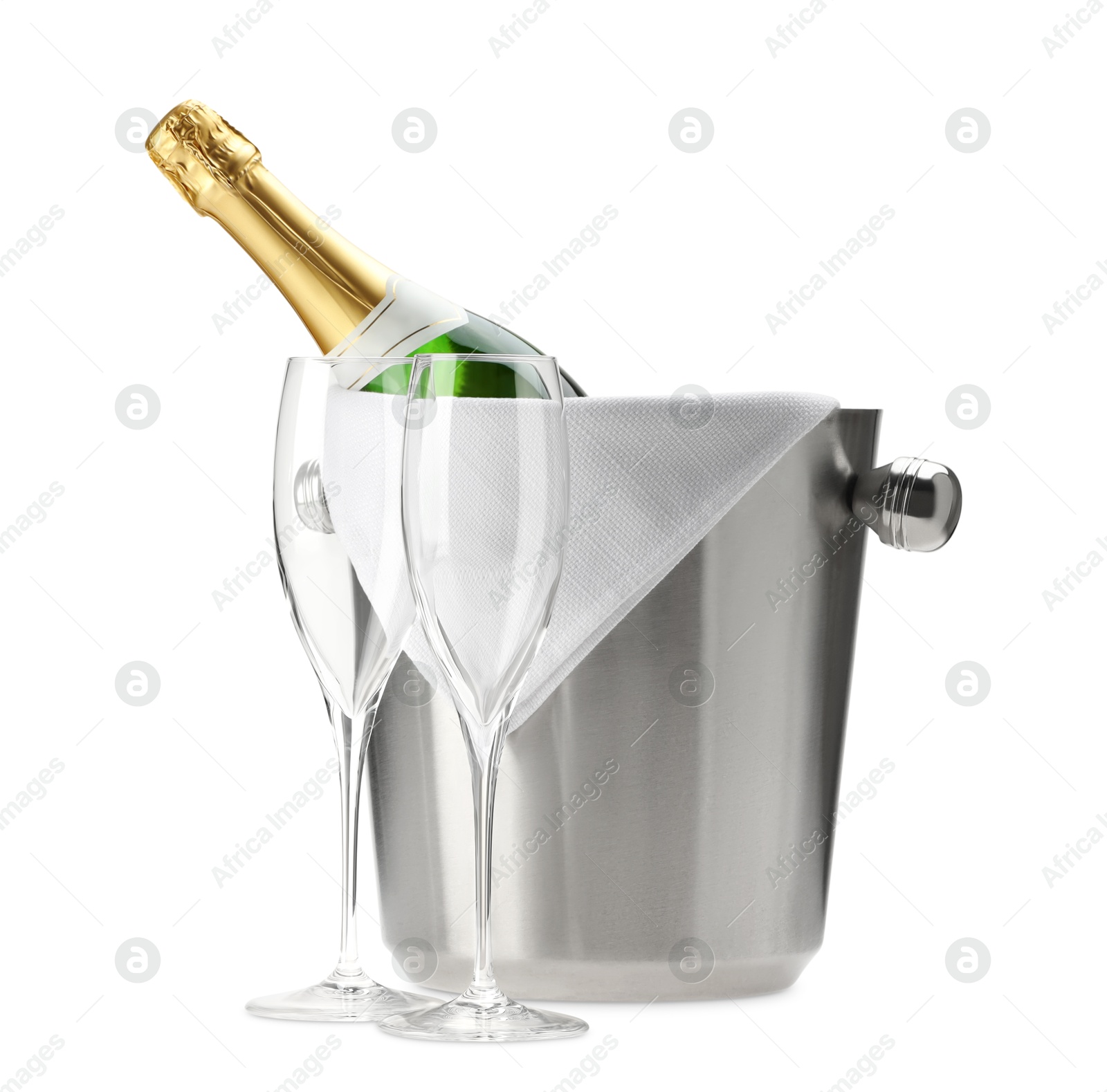 Photo of Bottle of champagne in ice bucket and empty glasses isolated on white