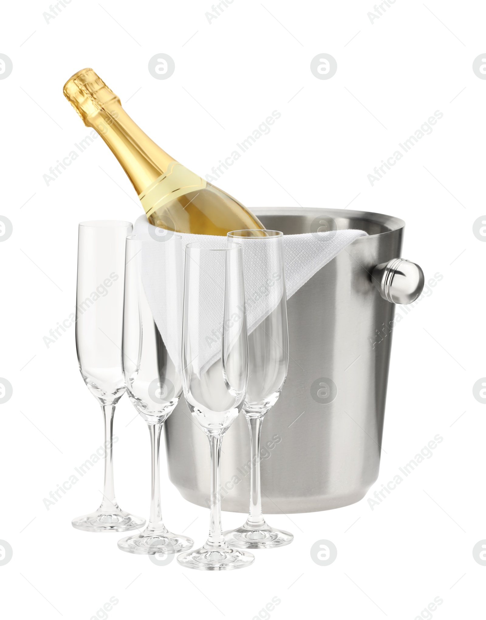 Photo of Bottle of champagne in ice bucket and empty glasses isolated on white