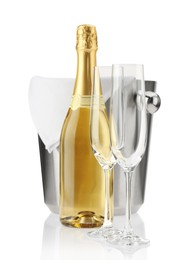 Bottle of champagne, ice bucket and empty glasses isolated on white