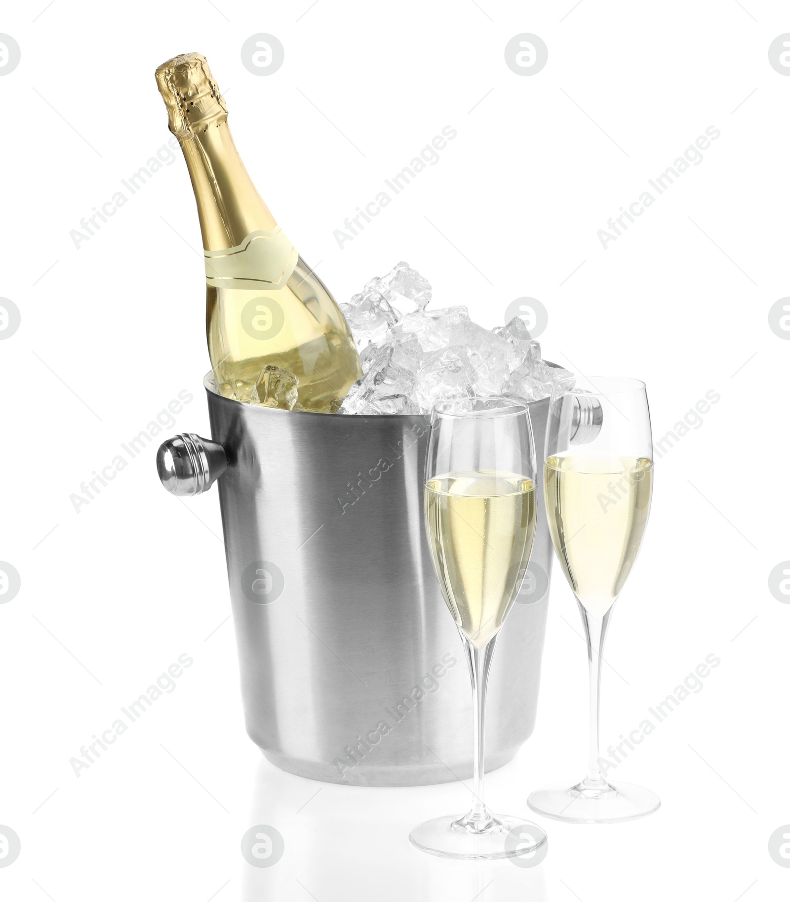 Photo of Champagne in glasses and ice bucket with bottle isolated on white