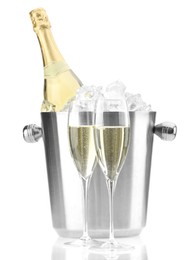 Champagne in glasses and ice bucket with bottle isolated on white