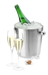 Champagne in glasses and ice bucket with open bottle isolated on white