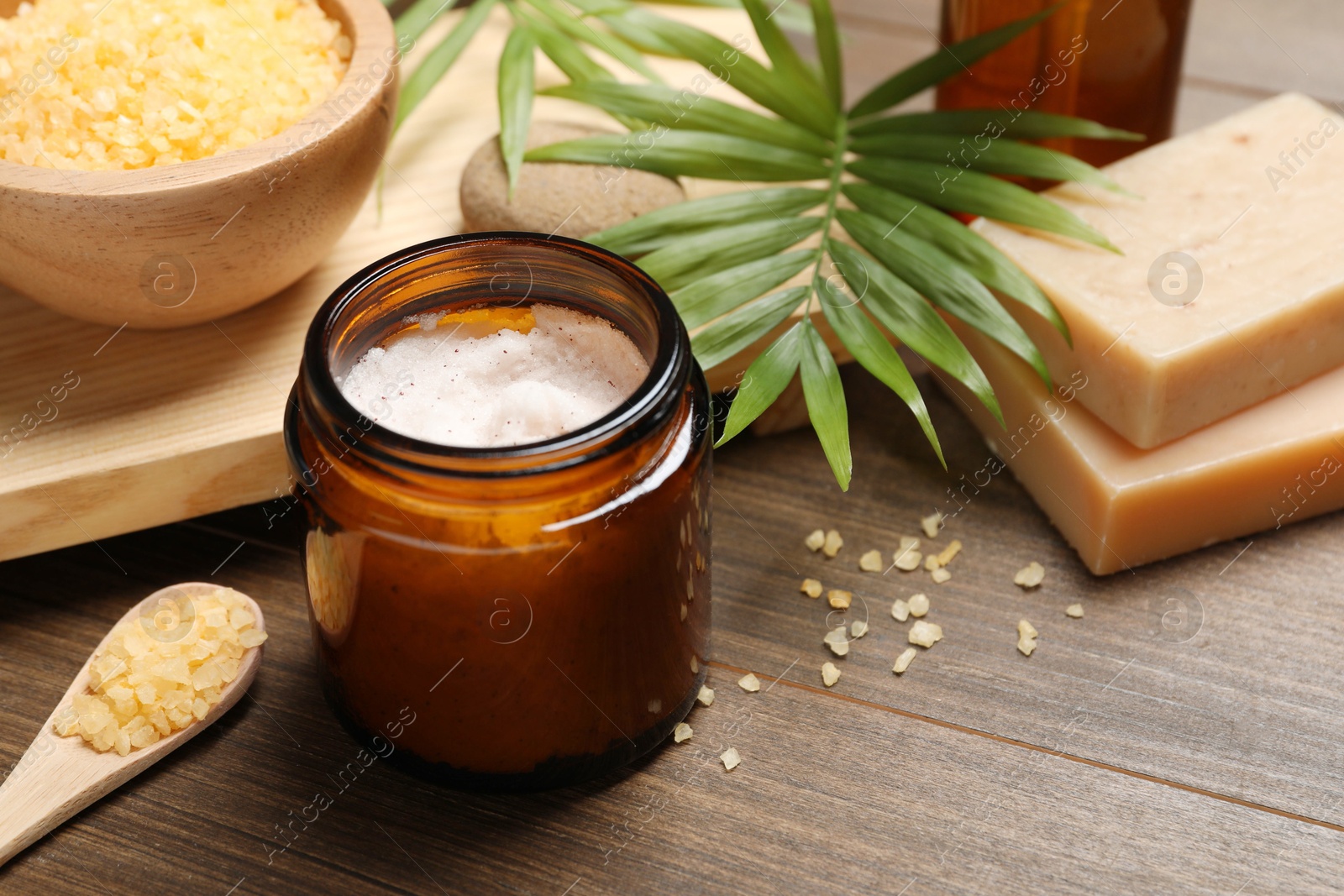 Photo of Spa composition with different cosmetic products on wooden table, closeup