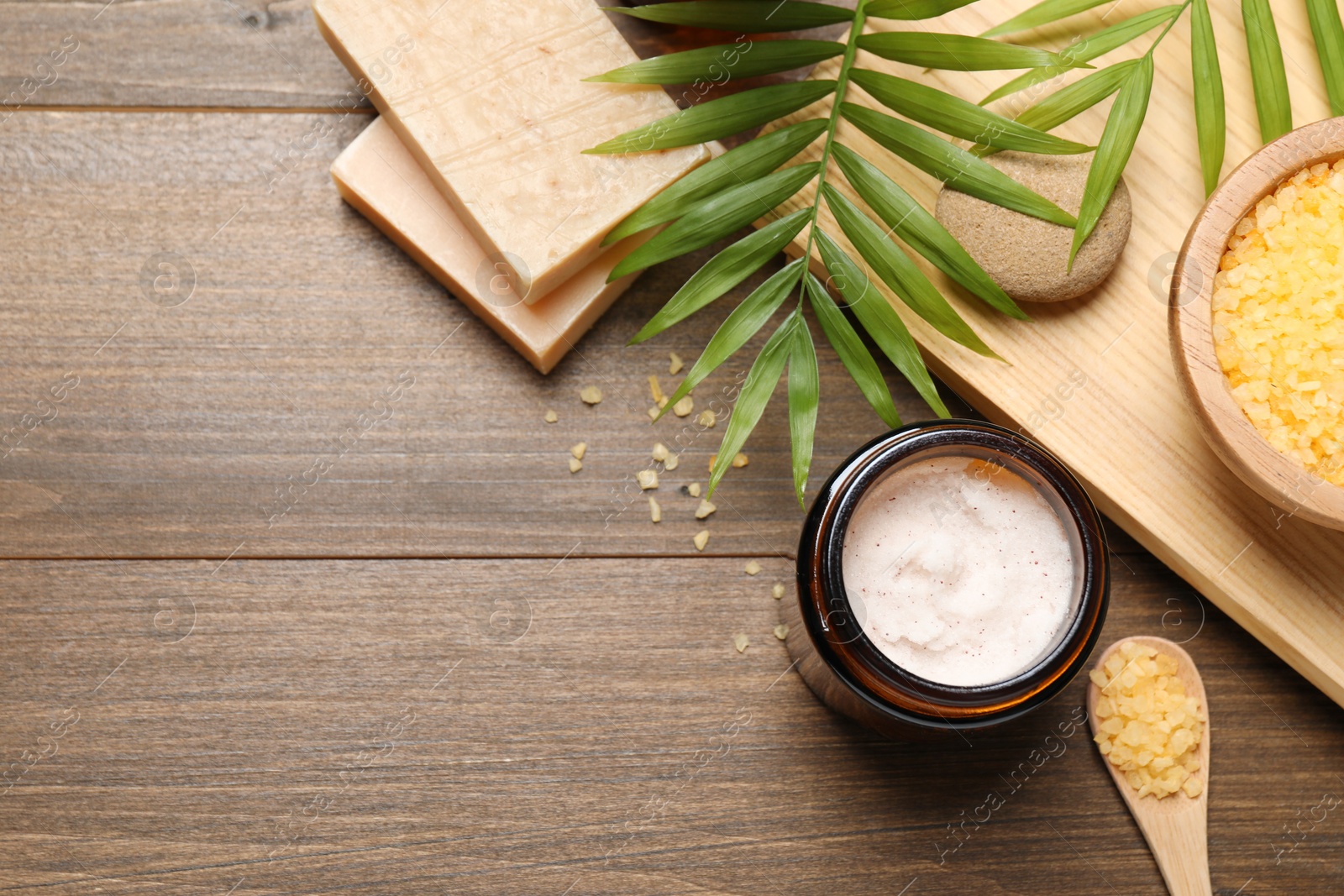 Photo of Spa composition with different cosmetic products on wooden table, flat lay. Space for text