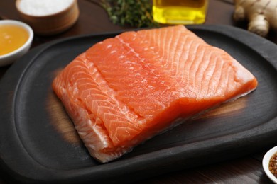 Photo of Salmon fillet and other products on table, closeup